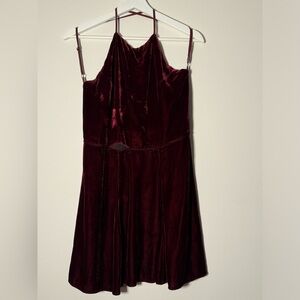 Velvet burgundy mini dress from The Reformation with cross back feature.